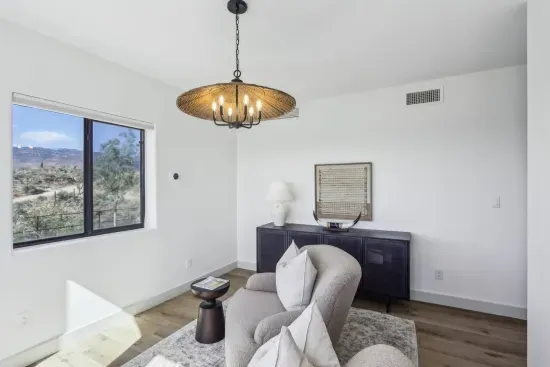 Living Room Retreat: Enjoy vibrant views and stylish decor in this sunlit escape!
