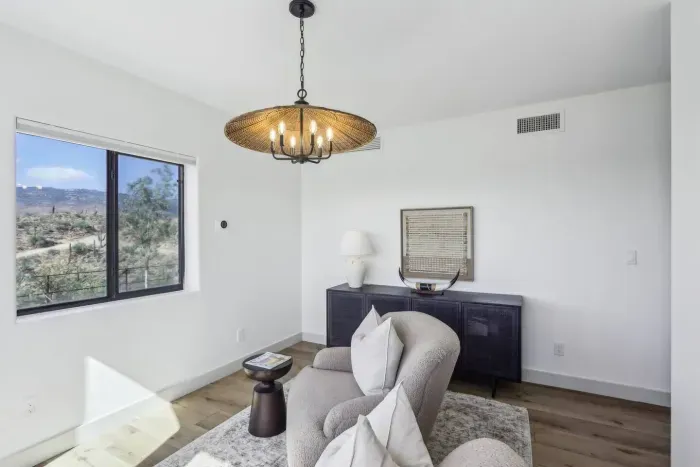 Living Room Retreat: Enjoy vibrant views and stylish decor in this sunlit escape!