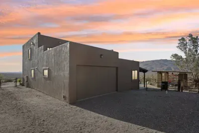 Desert Retreat: Experience stunning mountain views and serene sunsets from this unique adobe-style home!