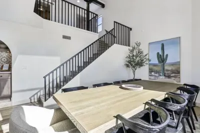 Dining Room: Enjoy vibrant meals at this spacious table, surrounded by modern decor and natural light!