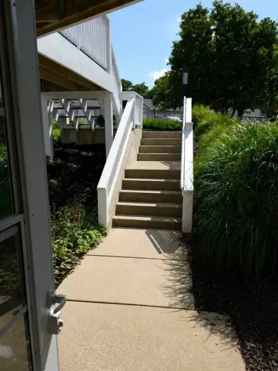 Please note; there are steps down to the front door of the condo unit.