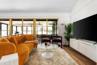 Living Room Oasis: Vibrant colors and stylish decor create the perfect backdrop for relaxation!