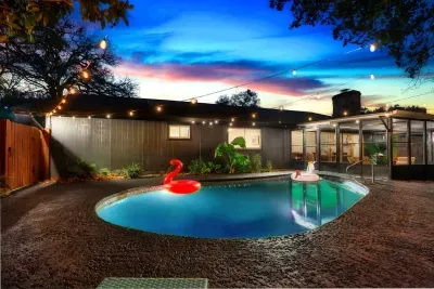 Poolside Paradise: Dive into fun with a sparkling pool, lush greenery, and twinkling lights!
