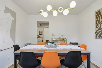 Dining Room: Vibrant design with chic lighting sets the stage for memorable meals together!