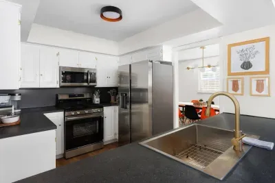 Gourmet Kitchen: Whip up culinary delights in this sleek, modern kitchen with elegant finishes!