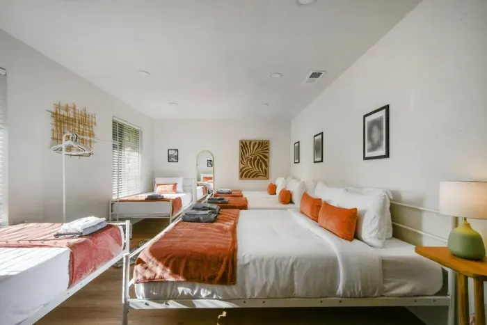 Spacious Family Retreat: Enjoy bright, comfy beds and vibrant decor—perfect for group getaways!