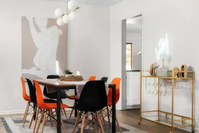 Dining Room: Modern flair with vibrant seating, perfect for gatherings and gourmet adventures!