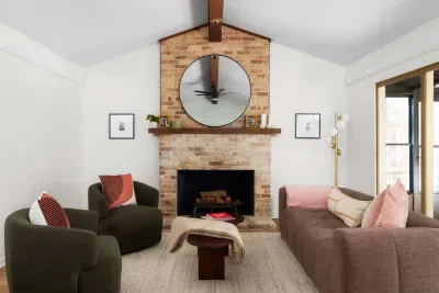 Living Room: Bright and inviting space with stylish seating and a charming fireplace for gatherings!