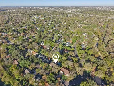 Birds-Eye-View: Nestled among lush trees, enjoy serene views and a vibrant Austin neighborhood! So close to Downtown!
