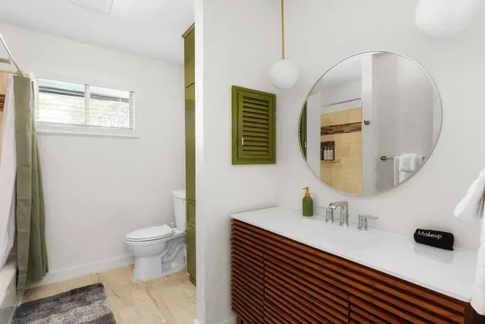 Bathroom Bliss: Stylish fixtures and natural light create a refreshing retreat for your stay!