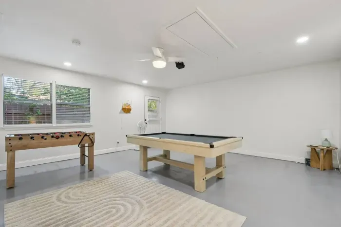 Game Room: Enjoy friendly competitions around the sleek pool table or foosball! We also have a movie projector for theme and film nights - Fun awaits!