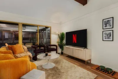 Living Room Oasis: Bright, stylish space with a retro vibe and perfect for binge-watching!