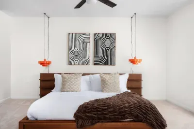 Stylish King Bedroom: Artful designs and vibrant accents create a perfect relaxation retreat!