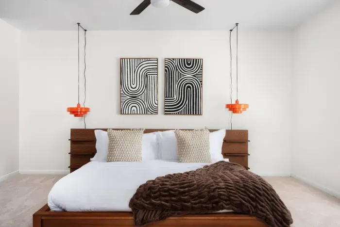 Stylish King Bedroom: Artful designs and vibrant accents create a perfect relaxation retreat!