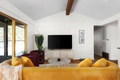 Living Room: Bright accents and spacious layout perfect for relaxation and entertainment!