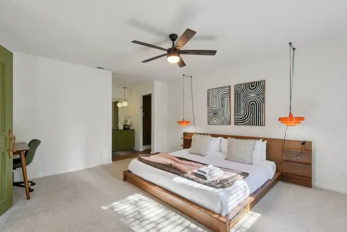 Master Bedroom: Vibrant art and modern lighting create a stylish retreat for relaxation and adventure!
