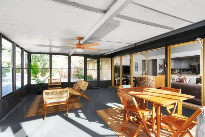 Sunroom Retreat: Brighten your mornings with sunlight and fresh air in this inviting space!