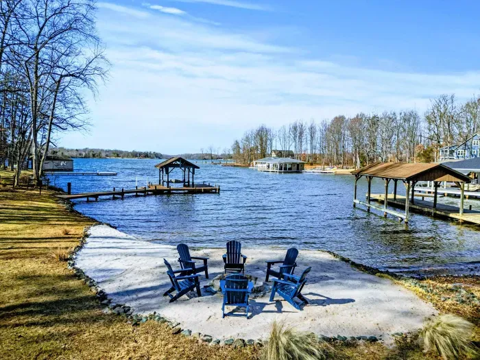 Waterfront Retreat – Comfortable Adirondack chairs set up for fireside storytelling.