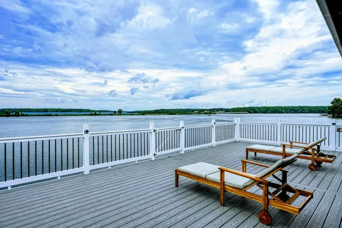 Spacious lakeside deck with sun loungers, offering a perfect spot for sunbathing and enjoying uninterrupted water views