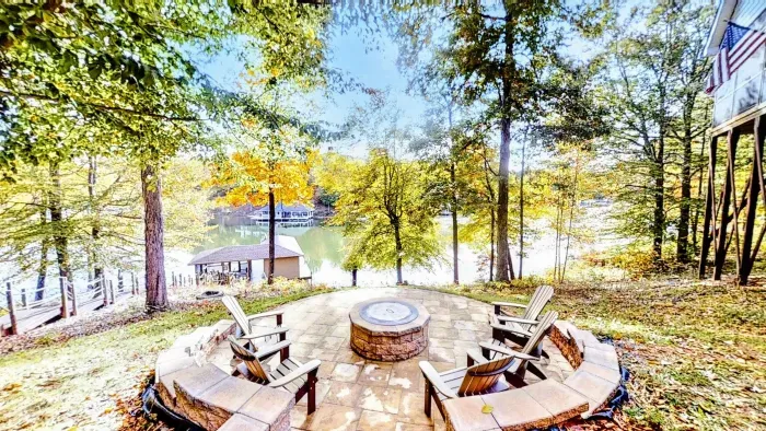 Unwind at this picturesque lakeside getaway featuring a cozy fire pit, scenic water views, and a peaceful ambiance perfect for relaxation.