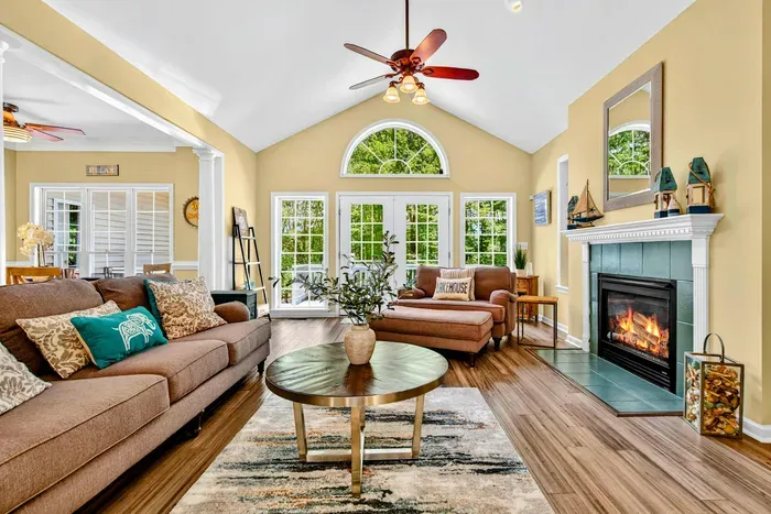 Vaulted ceilings, hardwood floors, and a stone fireplace. The great room keeps everyone together without feeling crowded.