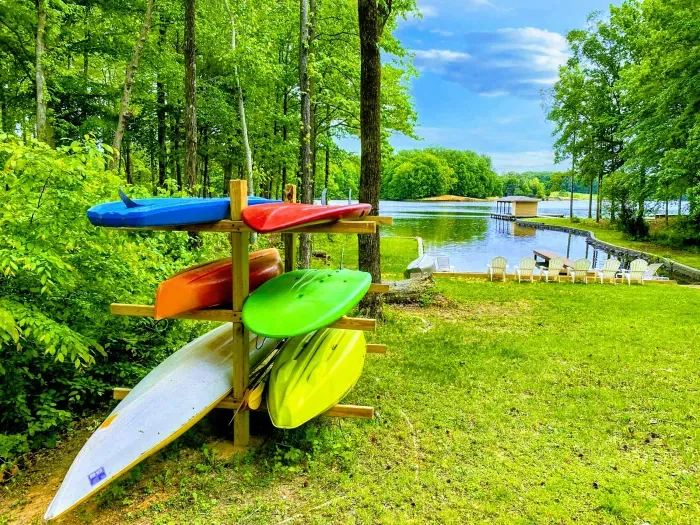 Lakeside kayak storage with easy water access, offering a peaceful spot for outdoor activities and relaxation by the dock
