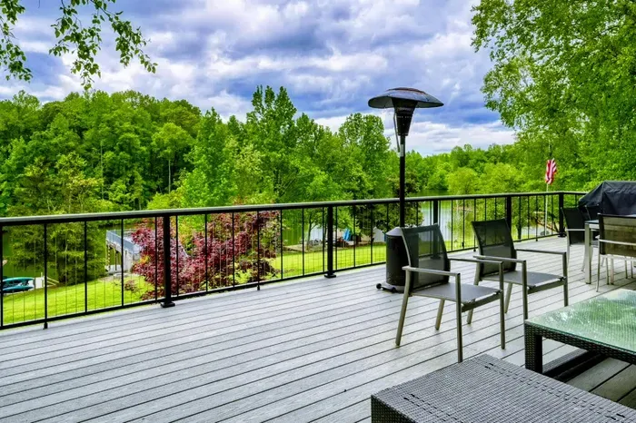 Lounge on this expansive deck overlooking Lake Anna, where modern furnishings and panoramic views make every moment magical.