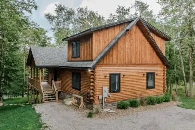 Welcome home. The cabin’s log exterior, easy parking, and wooded setting make arrival effortless — plus a 240v/50-amp outlet for EV charging (Tesla & more, BYO charging cable). Start relaxing the moment you pull in