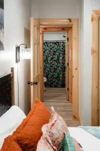 This hall bath connects to the bunk room and Deer Den & provides access for campers big and small, with all the comforts that make group stays a breeze