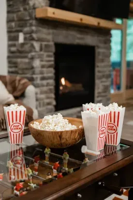Movie night, Camp Kindred-style. Popcorn in hand, fire roaring, friends all around