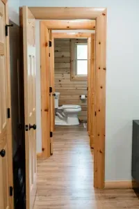 A tucked-away half bath off the kitchen and main suite = convenience right where you need it