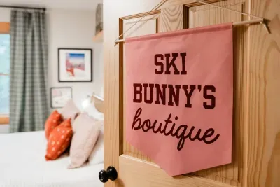 “Ski Bunny’s Boutique” brings a touch of après-ski glamour to the mountains.  Where soft pinks meet playful sparkle, and every detail, from marble tables to the mirror ball mushroom, proves that cozy can still shine