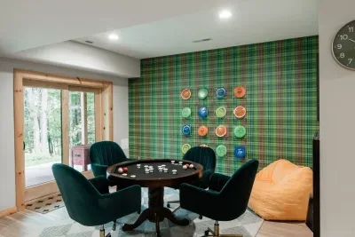 A nod to the 3-holes outside: our disc golf art wall makes the game area a camp classic