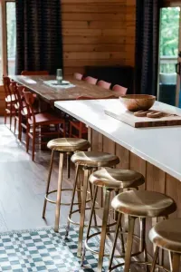 Plenty of room for everyone: with seating at the island and a long farmhouse table just steps away, there’s space for morning coffee chats, family feasts, and late-night games around the table