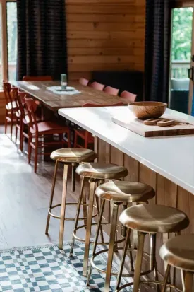Plenty of room for everyone: with seating at the island and a long farmhouse table just steps away, there’s space for morning coffee chats, family feasts, and late-night games around the table