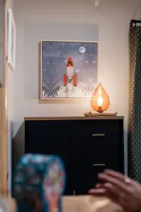 Every corner of Camp Kindred tells a story, and this one’s all about adventure. A glowing lantern shaped like a campfire keeps things cozy & a rocket ship blasting off on the wall reminds you that your dreams don’t have to stay grounded