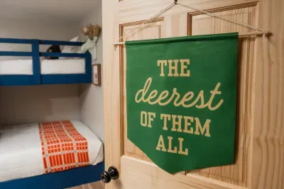 Behind this door you’ll find “The Dearest of Them All” - a bunk room where Camp Kindred’s youngest guests (or the most spirited grown-ups) settle in after a day of adventure