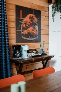 Fuel your mornings at the coffee bar—stocked with a ‘Great Wave’ of drip and single-serve options, flavored syrups, and a splash of personality from one of our favorite art pieces