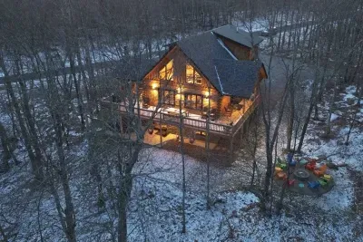 A snowy aerial view of Camp Kindred captures its perfect blend of privacy and play. With plenty of parking, a crackling firepit, and a steaming hot tub, winter days here feel both peaceful and unforgettable under the open sky