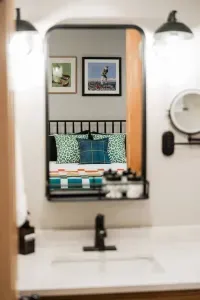 An ensuite bathroom just steps from your bed means you can tee off your day with ease—whether that’s chasing lake views, trail adventures, or an actual round of golf