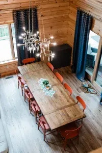 Gather the whole crew around this farmhouse table.  Seating for 10 beneath a statement chandelier (look closely, they are twigs!), perfect for holiday dinners, game nights, or long, lingering conversations