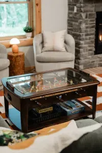 This table does double duty — foosball fun up top, board games stashed below