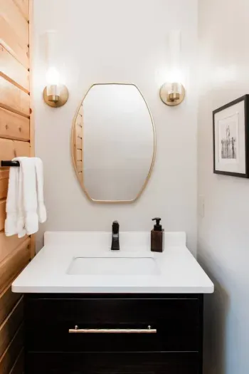 No need to wander far: this main floor powder room keeps things easy for guests and gatherings