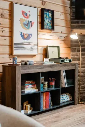 Every corner tells a story: curated art, a retro record player, and shelves stocked with books, games, and vintage finds invite you to slow down, explore, and make the space your own