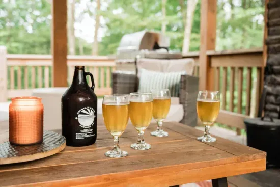 Pour a local pint and fire up the grill — the covered porch makes it easy to enjoy Deep Creek flavors with mountain views and a crackling fire close by