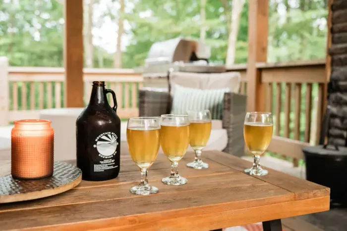 Pour a local pint and fire up the grill — the covered porch makes it easy to enjoy Deep Creek flavors with mountain views and a crackling fire close by