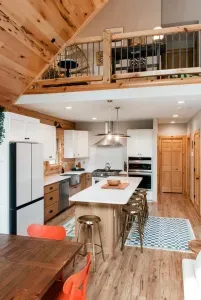 Gather around the heart of Camp Kindred... our modern cabin kitchen. With a spacious island with seating for 6, two ovens, and warm wood details, it’s designed for cooking together, late-night laughs, and making memories that last long after the meal