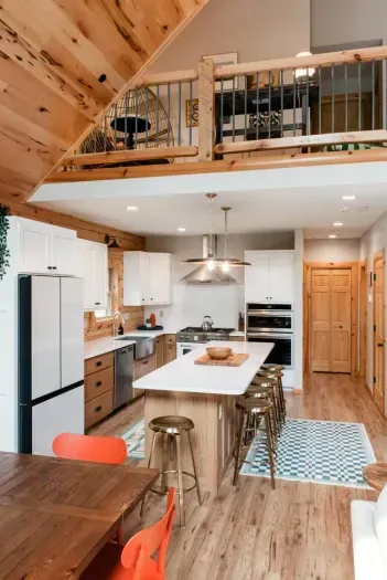 Gather around the heart of Camp Kindred... our modern cabin kitchen. With a spacious island with seating for 6, two ovens, and warm wood details, it’s designed for cooking together, late-night laughs, and making memories that last long after the meal