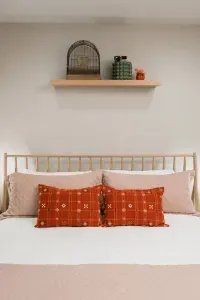 A Sealy pillow-top mattress, plaid accents, and warm light make this room the perfect après-adventure crash pad—because good sleep is always in season