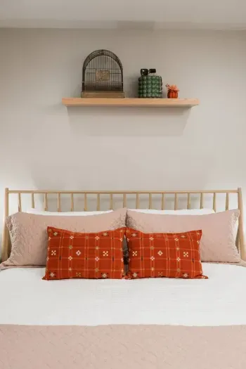 A Sealy pillow-top mattress, plaid accents, and warm light make this room the perfect après-adventure crash pad—because good sleep is always in season